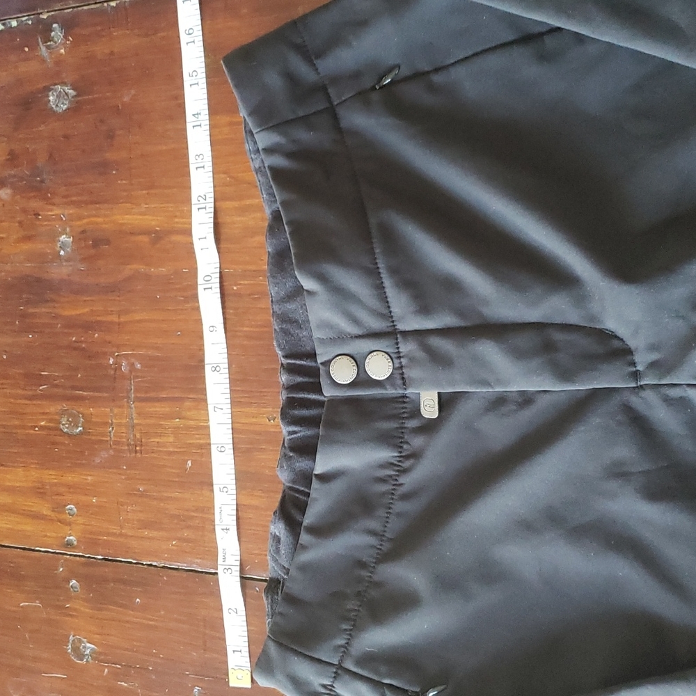 Snow pants. 2 zip pockets, one zip pocket on leg